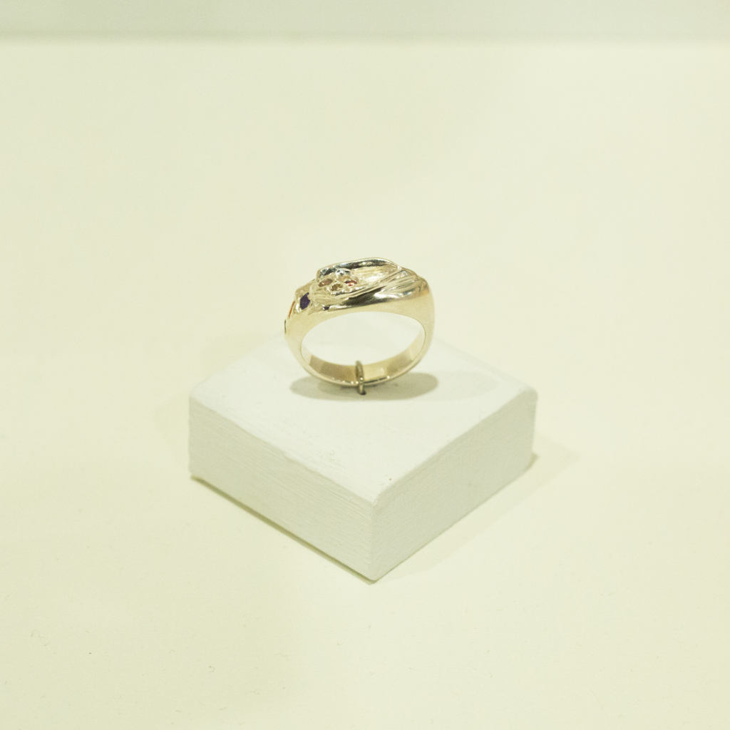 Anastasia Pindera, sterling silver vulva ring encrusted with rainbow gems