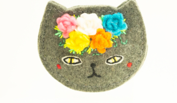 felted grey cat with flowers on head